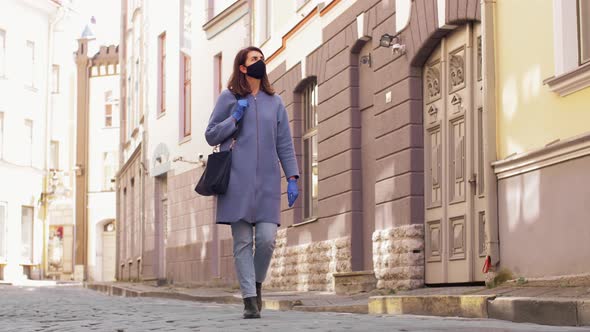 Woman Wearing Medical Mask and Gloves in City