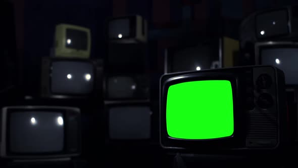 Old TV Green Screen over a Retro TV Wall. Dark Blue Tone.