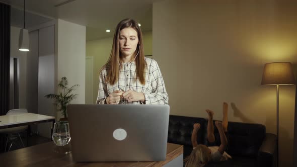 Business Woman Working with Kid Together From Home, Having a Video Call with Colleagues. Quarantine