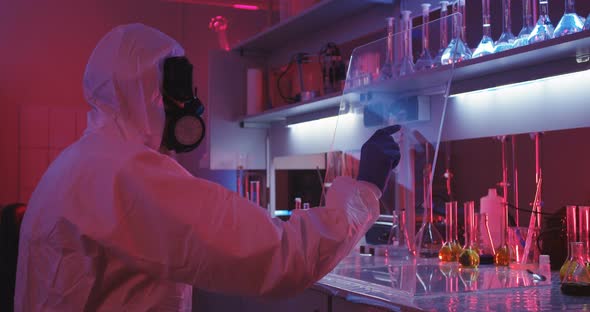 Scientist Using Transparent Display in Laboratory