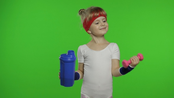 Girl in Sportswear Making Fitness Exercises with Dumbbells and Drinking Water. Little Athletic Child