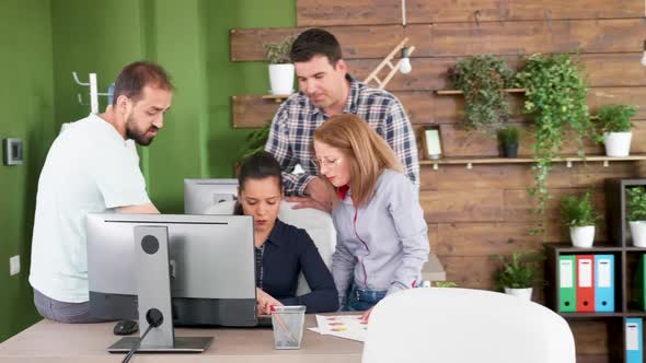 Excited Team About New Project Gathered Around Their Company Owner