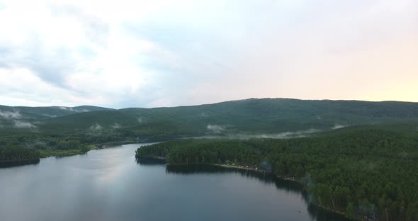 Mountain lake Turgoyak at sunset aerial view