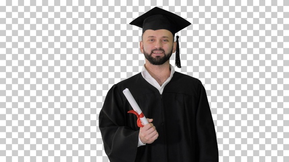 Happy young man in graduation hat holding, Alpha Channel