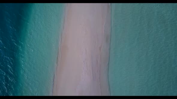 Aerial drone shot panorama of paradise seashore beach voyage by turquoise lagoon with white sand bac