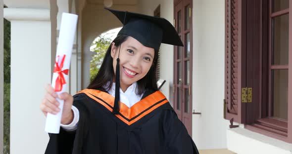 Asian woman get graduation in university campus