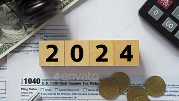 024 years. The new year 2024 tax concept.Business and tax concept .Calculator, currency,tax from close up.