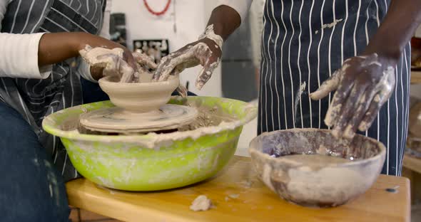 Black Couple in Love Working Together on Potter Wheel