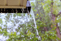 During heavy rain, water cascades from the overflowing gutters. - PhotoDune Item for Sale