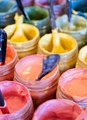 Large group of open cans of multi-coloured paints - PhotoDune Item for Sale
