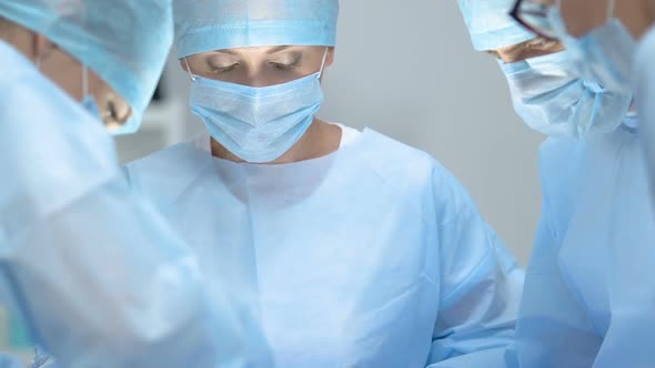 Group of Surgeons in Uniform Operating Patient Clinic, Health Care Professionals