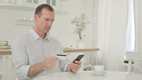 Online Payment Failure By Middle Aged Man on Smartphone