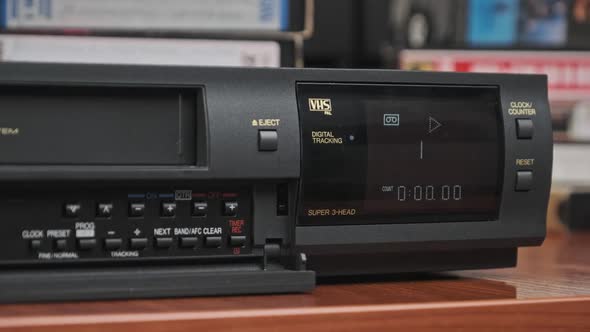 Insert VHS Cassette Into VCR and Push Play Button