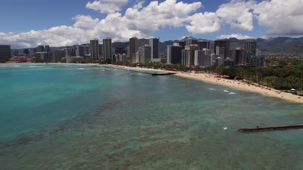 Honolulu and Waikiki Beach Aerial Push along the Beach