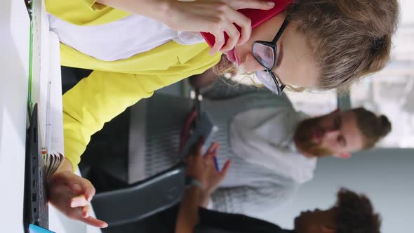 Vertical Screen Businesswoman Talking on Phone in Coworking Space