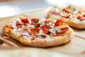 Delicious pepperoni pizza served on craft paper. Selective focus - PhotoDune Item for Sale