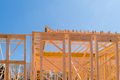 At the construction site there are beams of wood stick framing that will be used to construct a new - PhotoDune Item for Sale