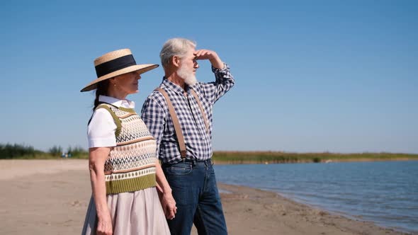 Happy Elderly Retirement Couple Resting Together By the Sea or Ocean Beautiful Romantic Elderly