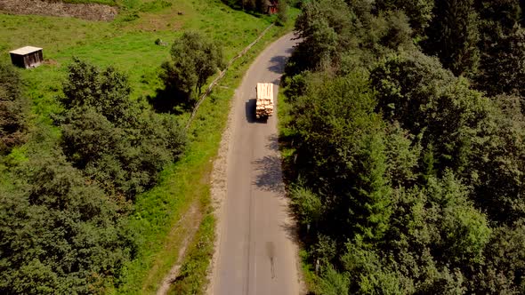 Aerial View of Car on Road in Mountains