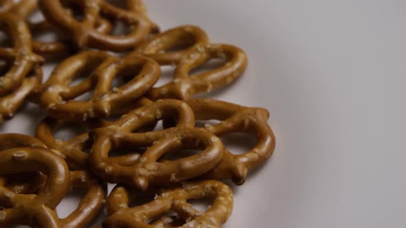 Rotating shot of Pretzels on a white plate - PRETZELS 009