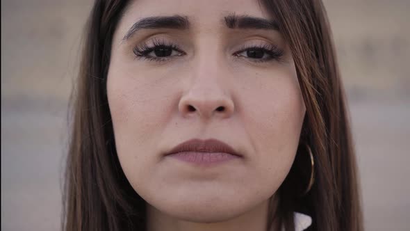 Outdoor Portrait of a Latina Woman Looking at the Camera with a Serious Face