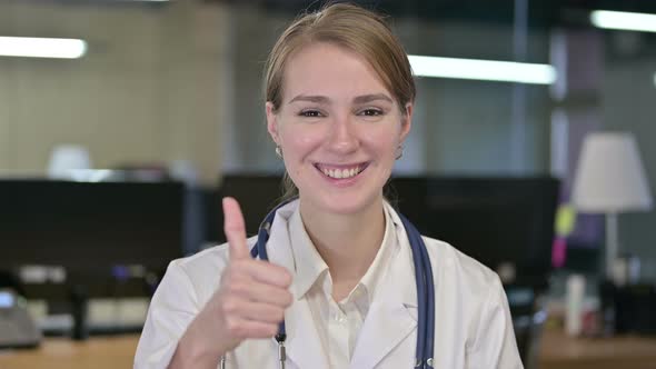 Portrait of Ambitious Young Female Doctor Doing Thumbs Up