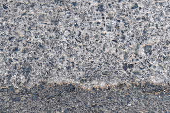 Dirty old asphalt road texture background.