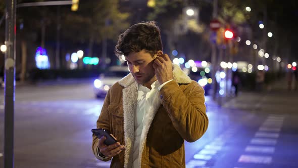 Man Browsing Social Media on Street