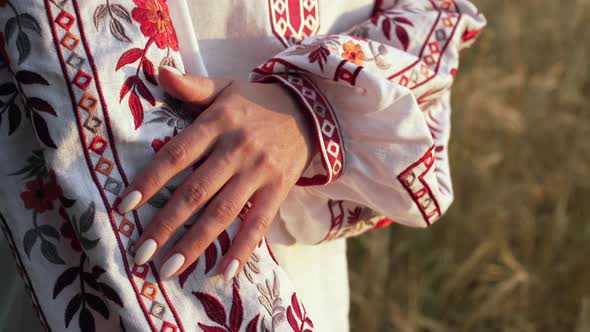 Ukrainian Woman Demonstrating Beautiful Details of Embroidery Ornament on Vyshyvanka Shirt