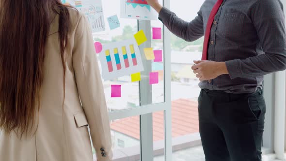 Business People Work on Project Planning Board