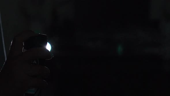 Closeup of Female Hand Splashing Deodorant on Black Background