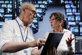 Elderly servicemen doing server analysis