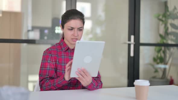 Indian Woman Reacting to Loss on Tablet