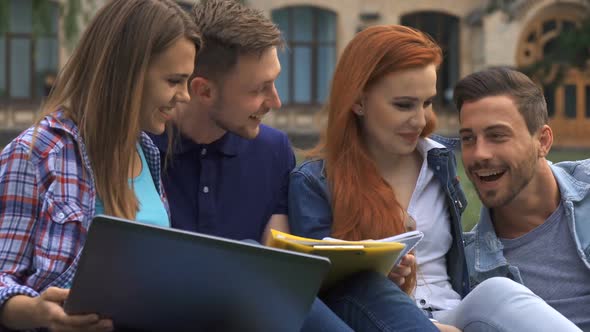 Students Discuss Something on the Lawn on Campus