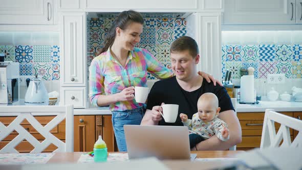 Happy Family in the Kitchen in the Morning