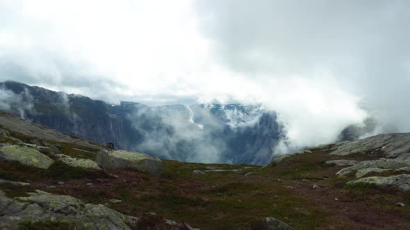 Clouds coming up the hill in Norway, Odda at the Trolltunga hiking path.