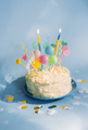 Birthday cake with candles and decor on blue background. Smash cake - PhotoDune Item for Sale
