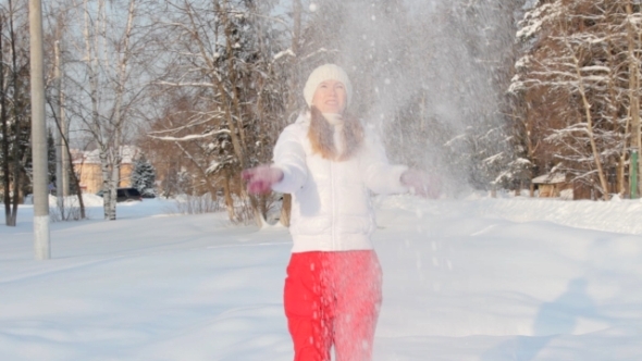 Girl Playing with Snow