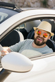 Happy man sitting in white convertible car with beautiful view and having fun - travel summer - PhotoDune Item for Sale
