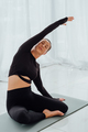 Mature woman instructor perform simplified pigeon pose and hold side tilt. - PhotoDune Item for Sale