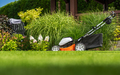 Cordless Battery Powered Grass Mower in the Garden - PhotoDune Item for Sale