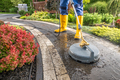 Garden Worker Pressure Washing Decorative Bricks Garden Paths - PhotoDune Item for Sale