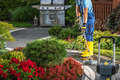 Homeowner Pressure Washing His Bricks Garden Path - PhotoDune Item for Sale