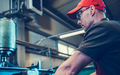Metalworking Worker in Front of Metal Drilling Lathe - PhotoDune Item for Sale