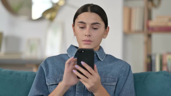 Latin Woman Using Smartphone