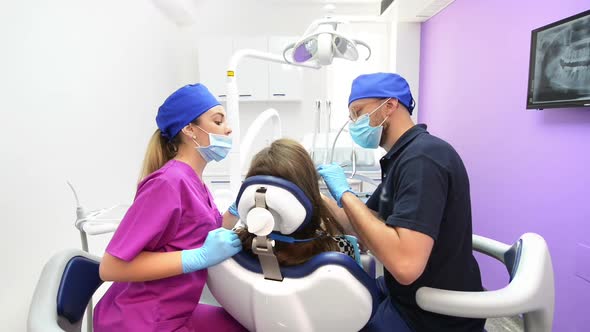 Medical Team Treating Patient at Dental Clinic