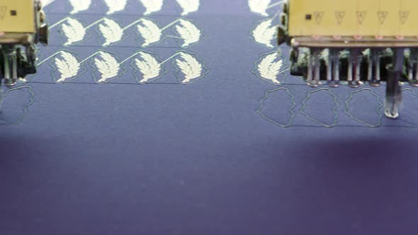 Dolly Shot of Modern Sewing Machine Doing Digital Pattern
