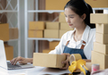 Beautiful young woman with online sales and delivery business. - PhotoDune Item for Sale