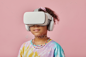Schoolgirl with VR headset standing in front of camera during game