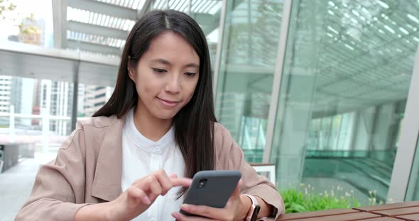 Business Woman Use of Smart Phone at Outdoor Cafe